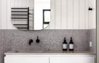 Bespoke Bathroom Vanity | Single Sink | Maximised Storage Compact bathroom vanity with a matte white finish, featuring a single sink, matte black tapware, and ample storage.