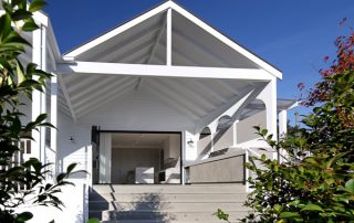 Luxury Outdoor Entertaining Area | Bespoke Outdoor Kitchen Luxury outdoor entertaining area with bespoke BBQ joinery, a grey cement compact laminate finish, and seamless indoor-outdoor flow.