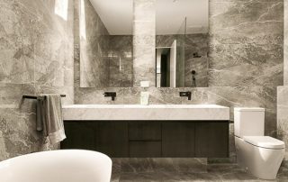 Modern Ensuite Vanity | Black Wenge Ravine Finish Modern ensuite dual sink vanity with a white countertop and custom mirrors.