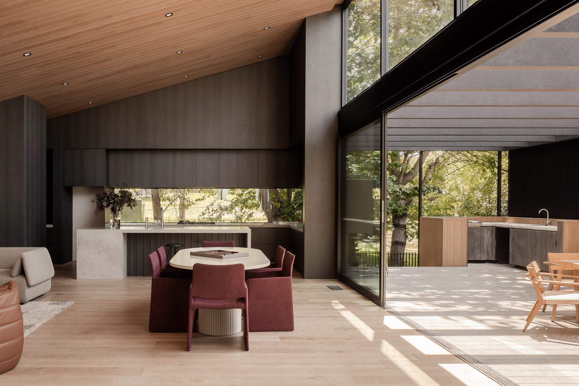 Seamless kitchen design with indoor-outdoor living integration—tailored joinery for high-end residences.