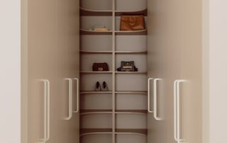 Hampton Residence – Wardrobe Contemporary walk-in wardrobe space featuring tailored shelves. open compartments and soft recessed lighting.