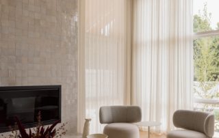 Hampton Residence – Fireplace Light-filled living space with soft sculptural seating, refined detailing, and a calm, neutral material palette.