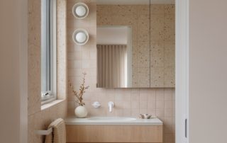 Hampton Residence – Ensuite Contemporary bathroom featuring custom joinery and mirror in a warm neutral palette.