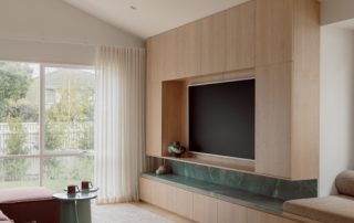 Hampton Residence – Media Wall Joinery Bespoke media wall featuring custom joinery with integrated shelving, recessed display, and marble benchtop detail in a calm, contemporary living space.